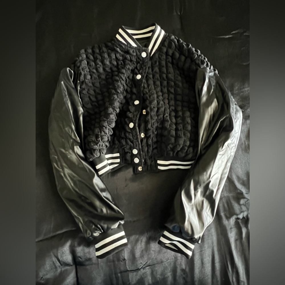 Reversible jacket. Never worn. Wrinkled from storage folding